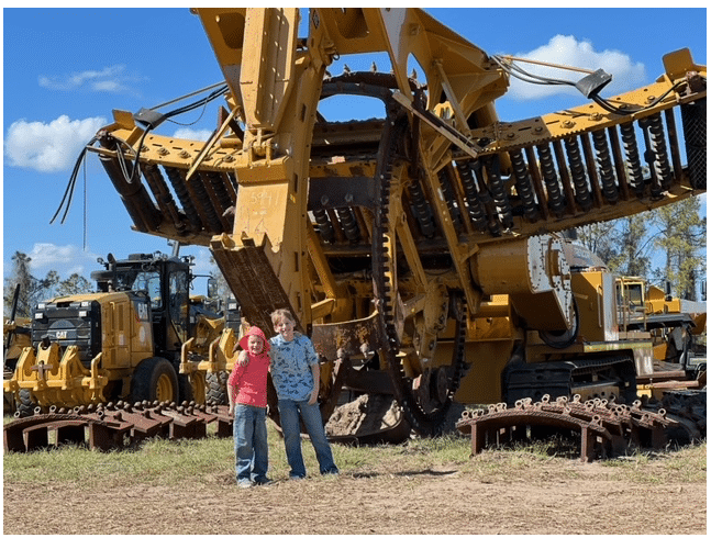 boy in front of machinery